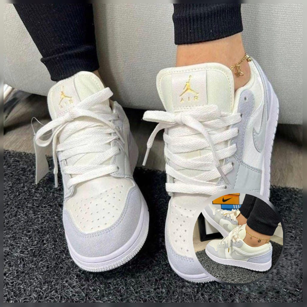 Zapatos de moda Nike Jordan en color negro con detalles blancos, vista lateral del calzado en imagen de moda.