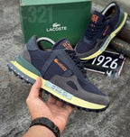 Zapatos Lacoste Ton A1 de moda en color blanco con detalles en cuero y suela antideslizante, diseñados para estilo y comodidad.