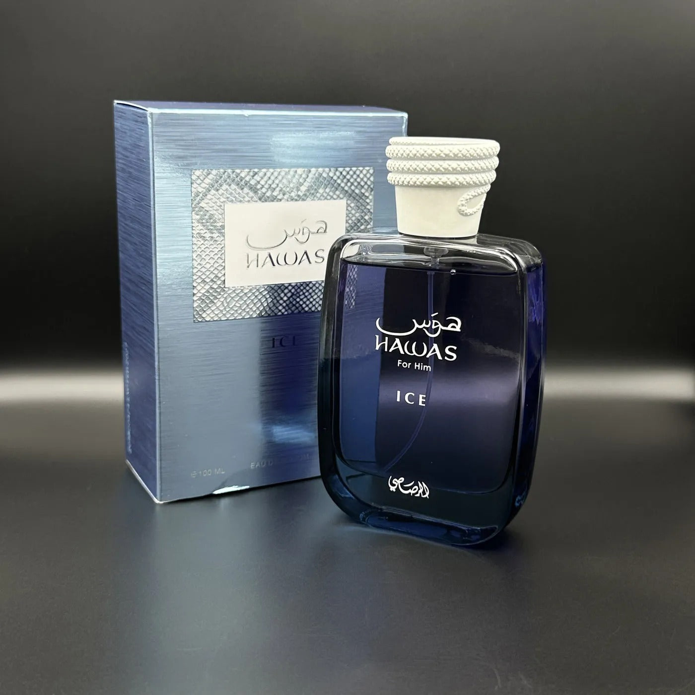Perfume Hawas Ice Rasasi de Aroma Primera, frasco de 100 ml, con diseño elegante y detalles en color azul.