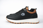 Zapatillas negras Brahma Casual Strike de Tula, estilo deportivo y cómodo, con diseño moderno y suela de goma visible.